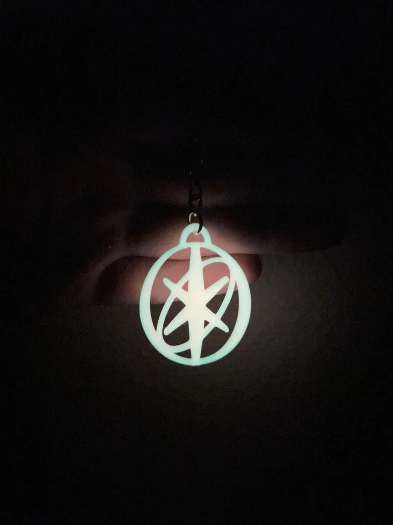 Katseye Inspired Logo EYEKONS Glow-in-the-Dark Keychain - KATSEYE MERCH​
