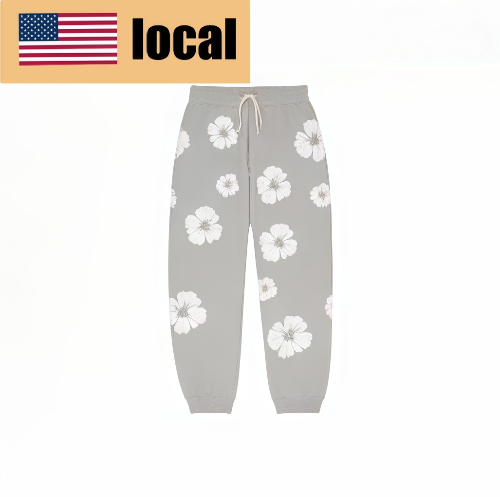 Denim Tears color-block garland-print lace-up track pants - Lulualo