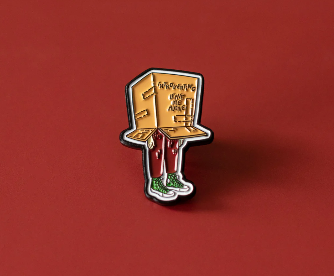 Introverting enamel pin