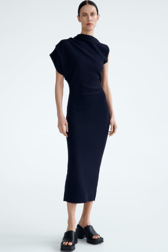 ASYMMETRIC SLEEVE KNIT DRESS