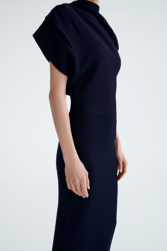 ASYMMETRIC SLEEVE KNIT DRESS