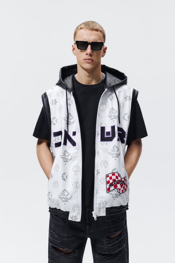 PRINTED PATCH FAUX LEATHER VEST
