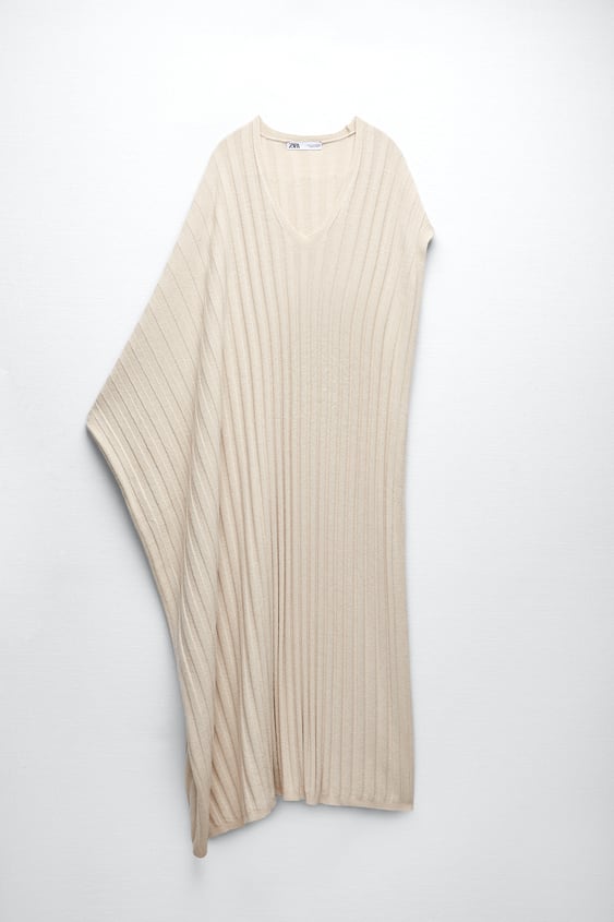 ASYMMETRIC SLEEVE KNIT CAPE