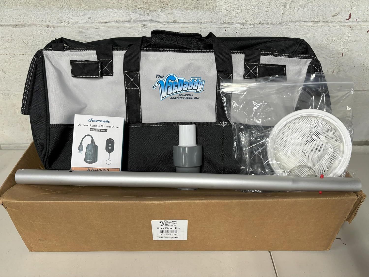 The VacDaddy Pro Bundle Accessory Kit with V2W Kit, Aluminum Adapter Pole, Shallow Water Adapter, VacCaddy, and a Remote On/Off Switch.