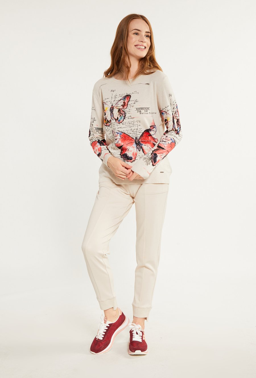 Wzorzysty sweter z dżetami