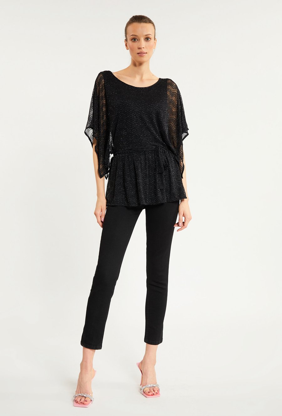 Błyszcząca bluzka damska z falbanką